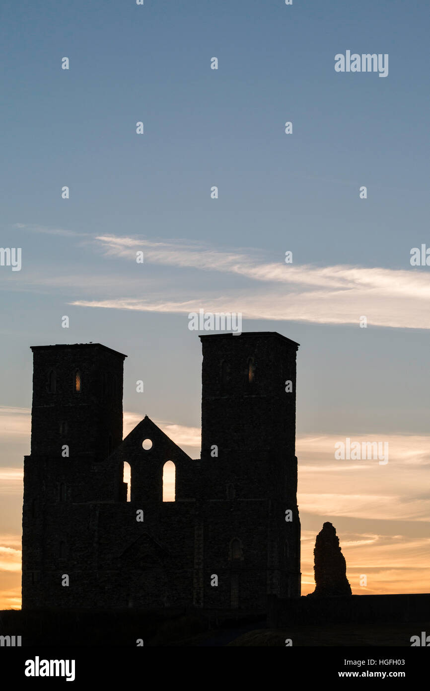 England, Reculver. Silhouetted landmark twin towers of 12th century Angelo-Saxon church, against the blue dawn sky. Stock Photo