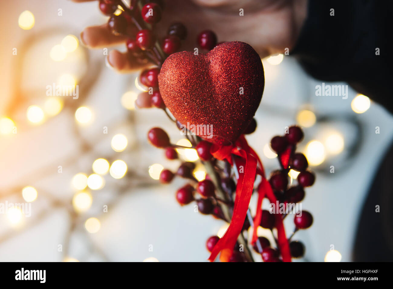 girl holding a red heart in the hands Stock Photo - Alamy