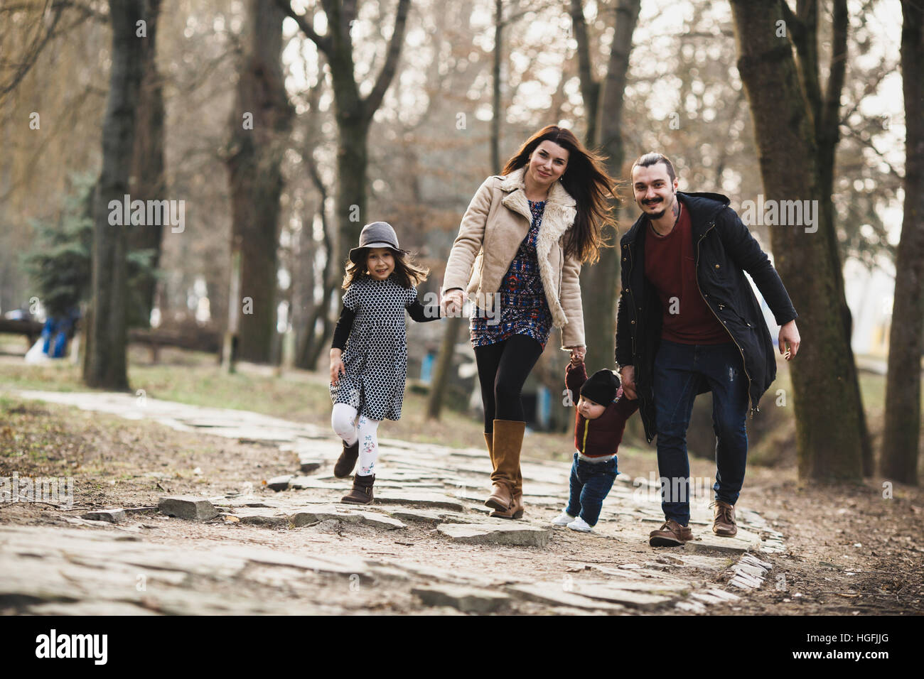 happy family walking in the autumn park Stock Photo - Alamy