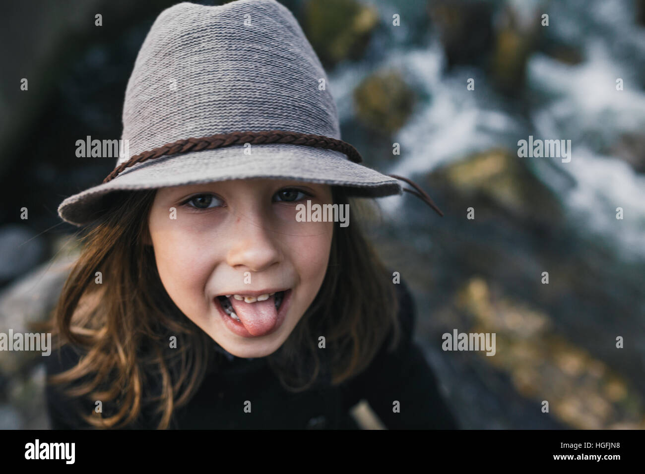 little girl in a black coat and hat Stock Photo Alamy