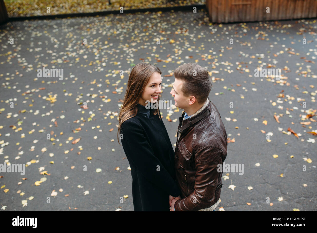 attractive happy couple walking in autumn park Stock Photo - Alamy