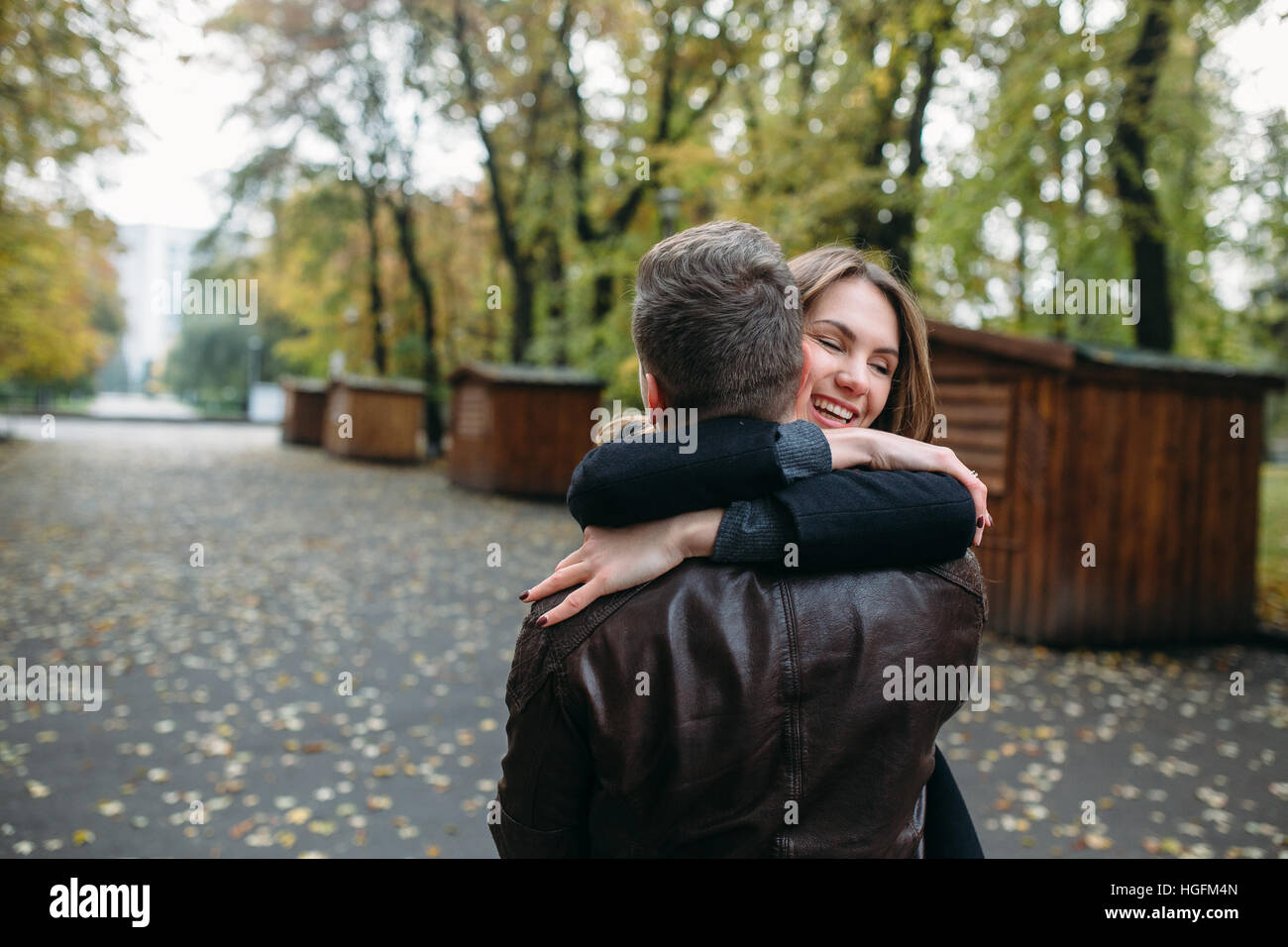 attractive happy couple walking in autumn park Stock Photo - Alamy