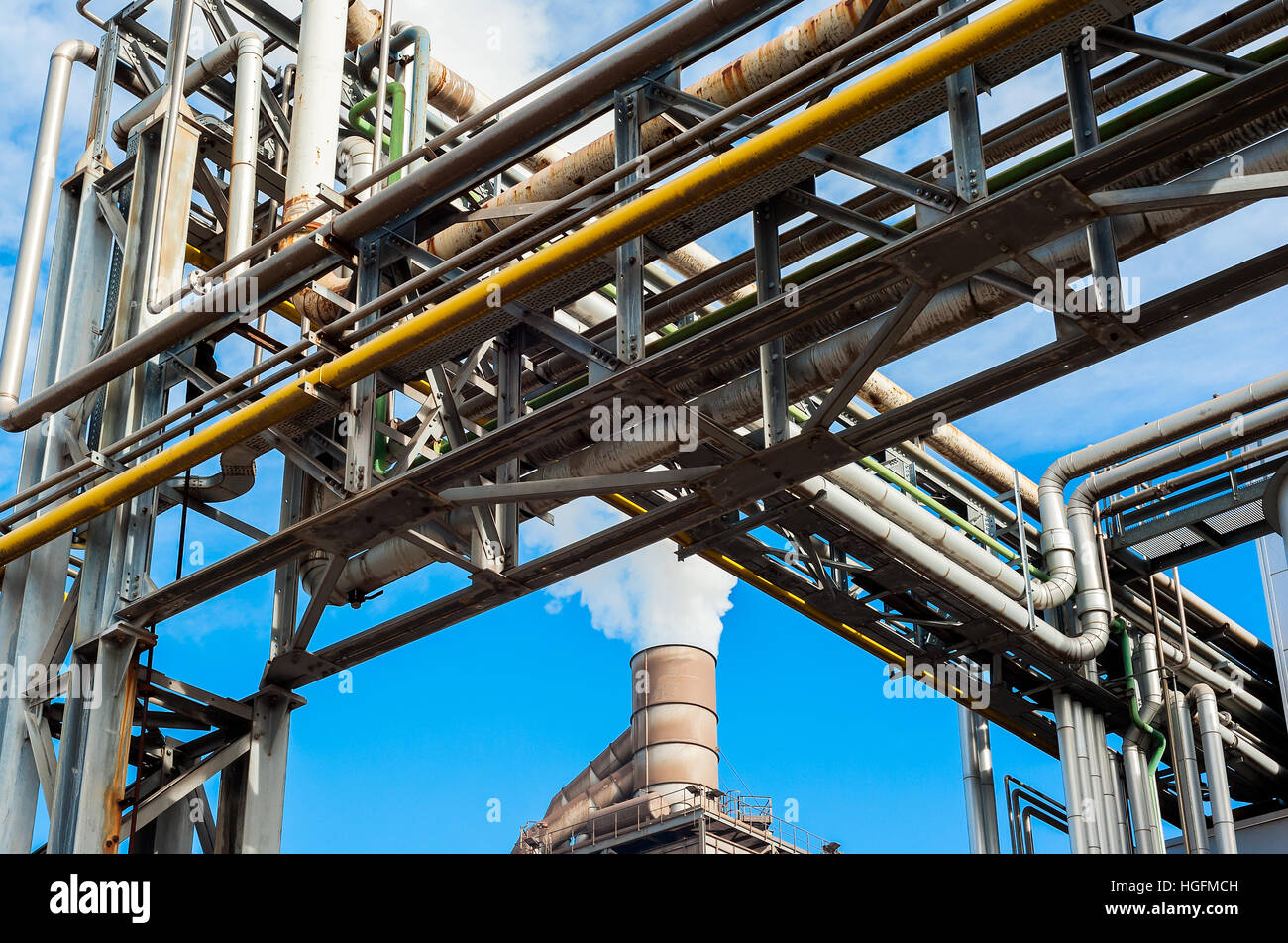 Chemical plant for factory, with smokestack on blue sky. Stock Photo