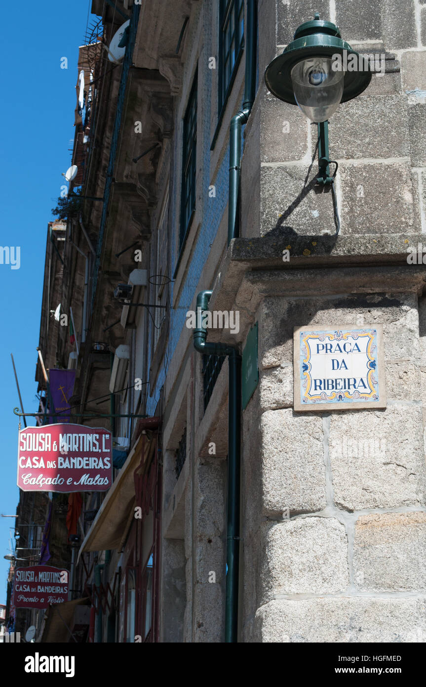 Porto: street lamp and the sign of the central Praca da Ribeira, the River Square, with view of the signs of historic craft shops Stock Photo