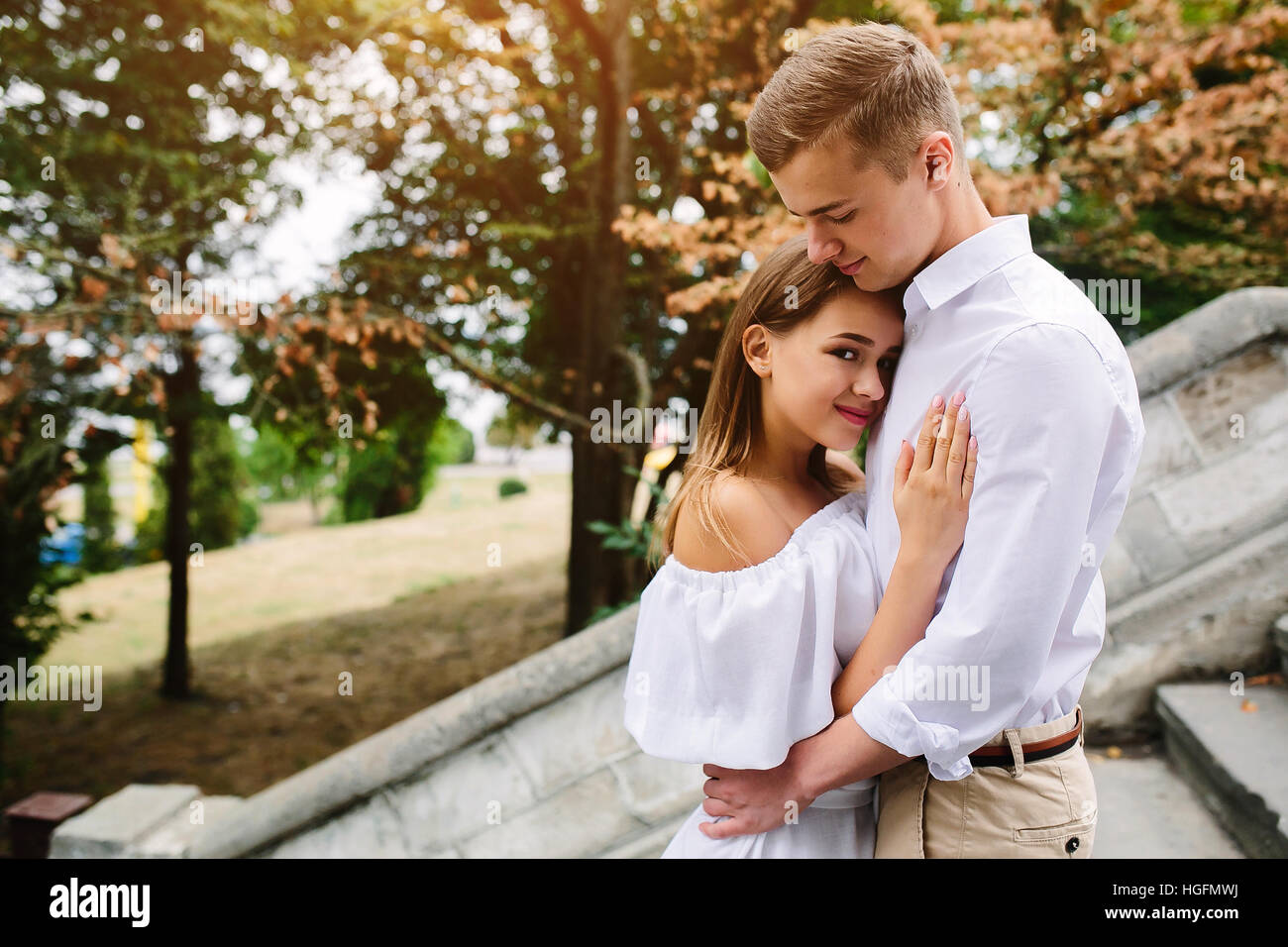couple posing in the park Stock Photo - Alamy