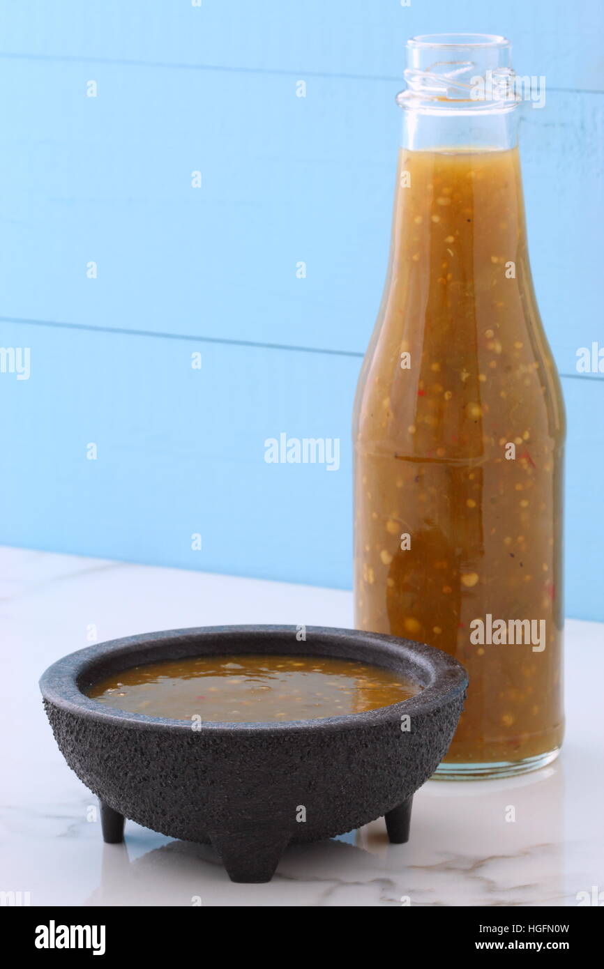 Artisan mexican tomatillo sauce on retro vintage carrara marble setting