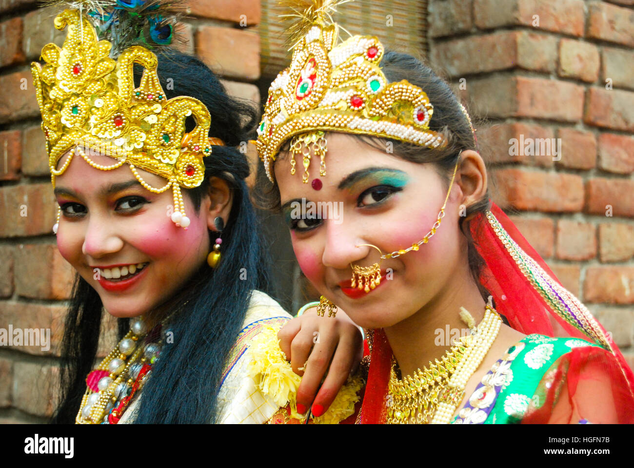 Teenagers dressed as lord Krishna & his consort Radha on the festival of Janmashtami. New Delhi, Delhi, India. Stock Photo