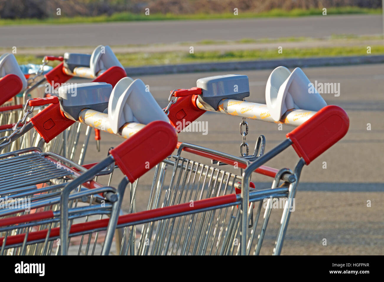 row of shopping trolleys or carts in supermarket Stock Photo