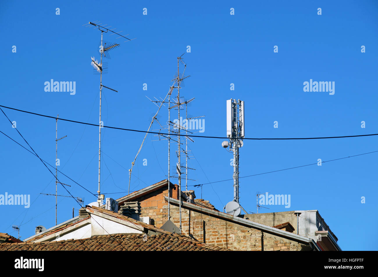 television antenna on roof with blue sky Stock Photo