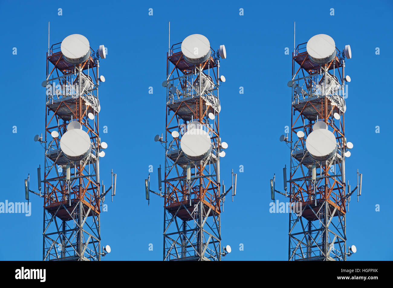 Telecommunication tower with antennas blue sky Stock Photo