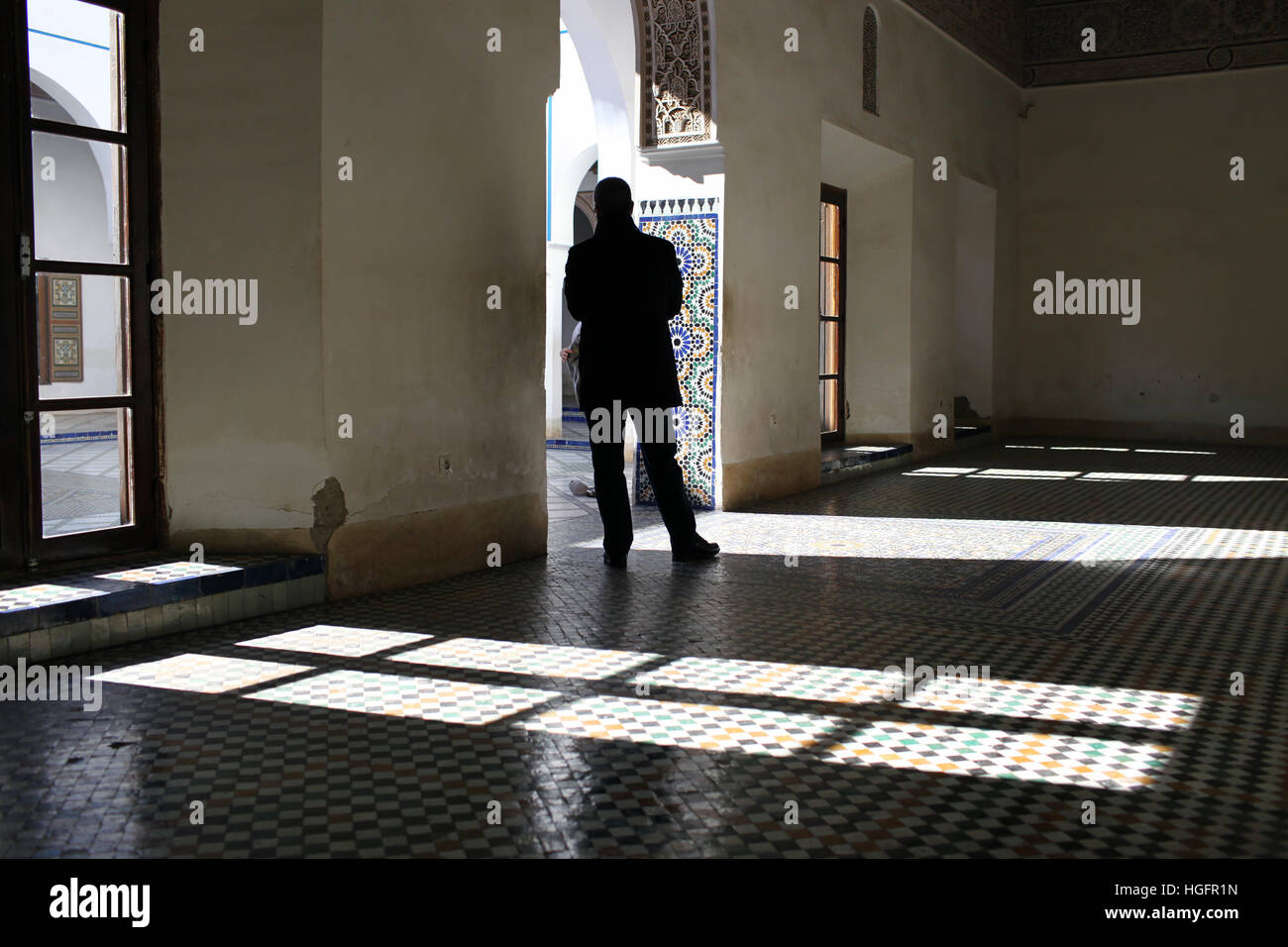 Man stands in the shadows inside Bahia Palace Stock Photo