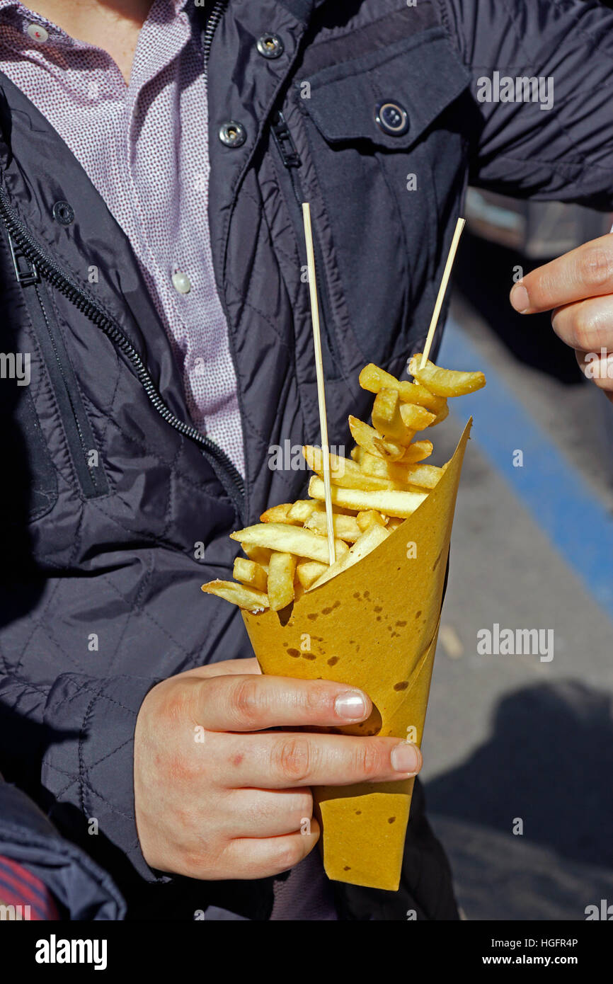 Typical street food potato chips in a summer festival. Stock Photo