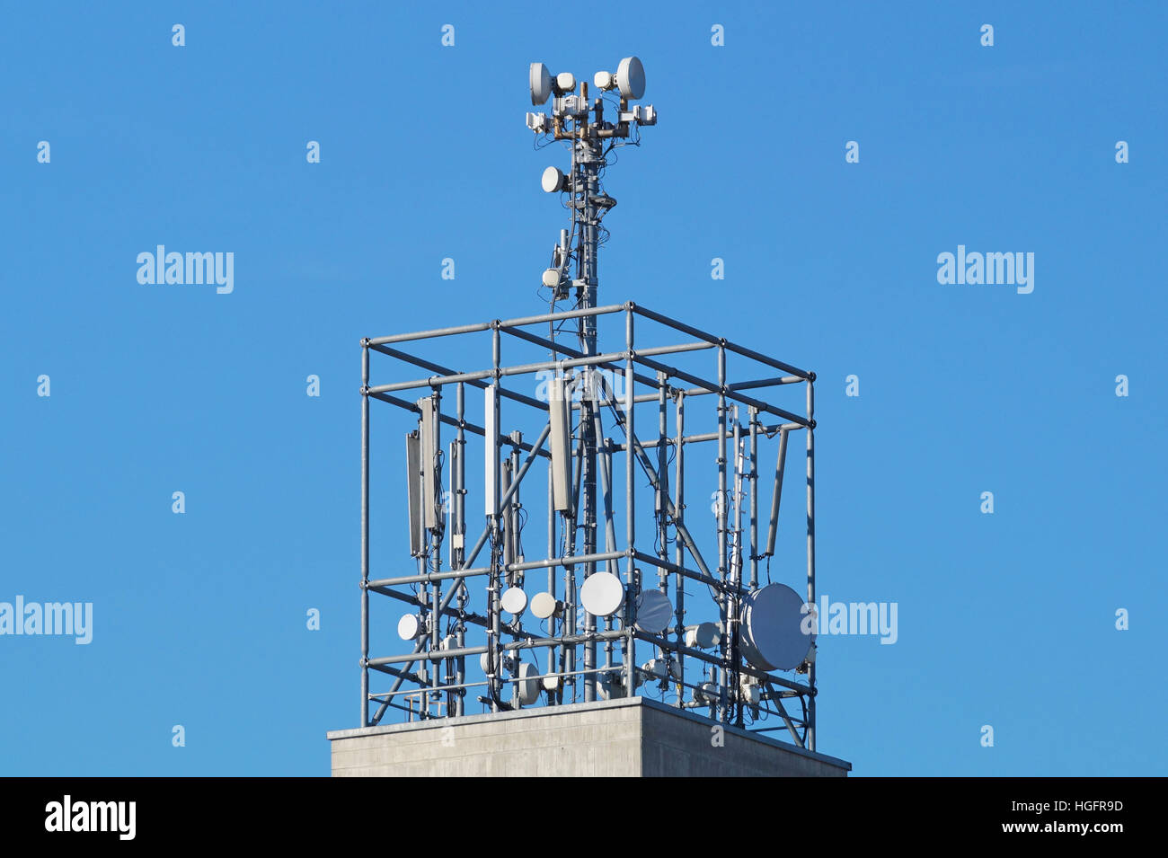 Lots of telcommunication antennas on the roof  a house Stock Photo