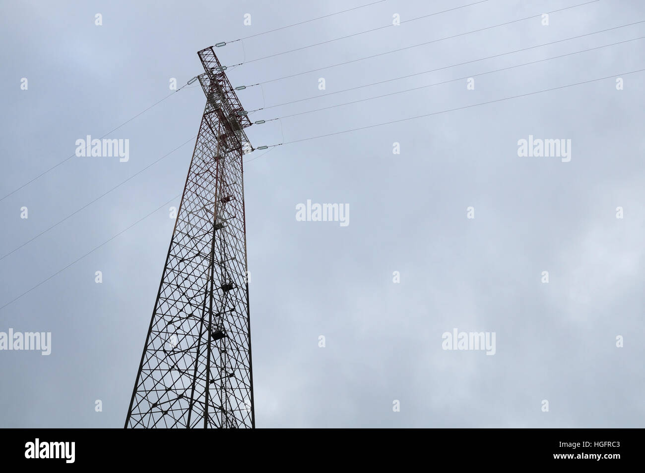 Silhouette of electricity post on blue sky background,low angle shot ...