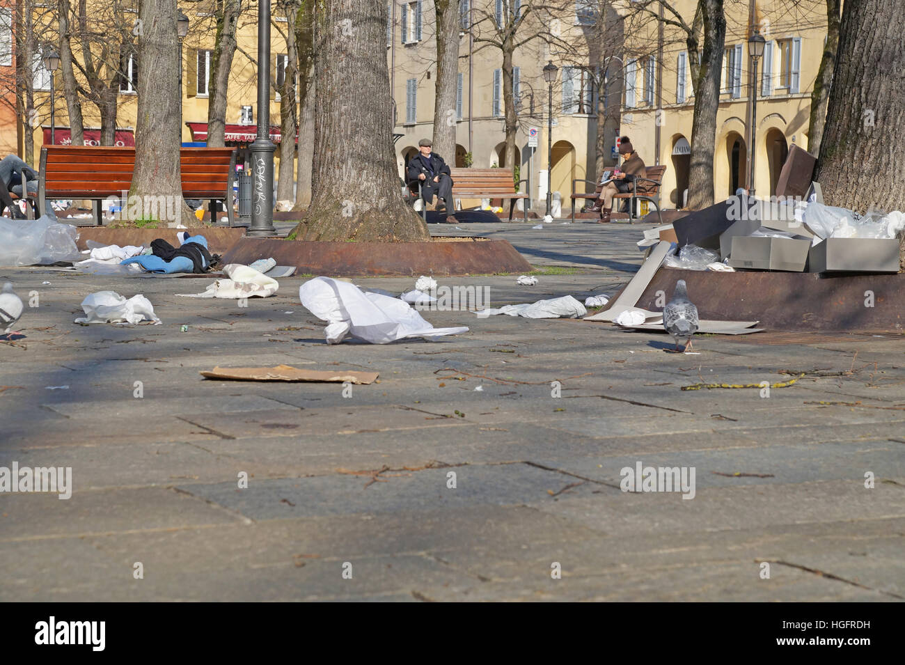Garbage Cans. Wheelie Bins. Trash Bags. Rubbish scattered out over the