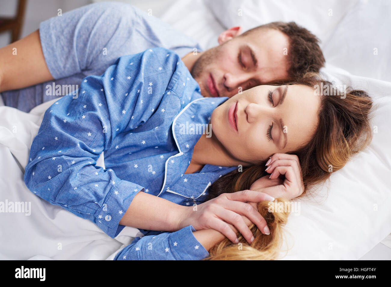 Close up of sleeping together couple in bed Stock Photo Alamy