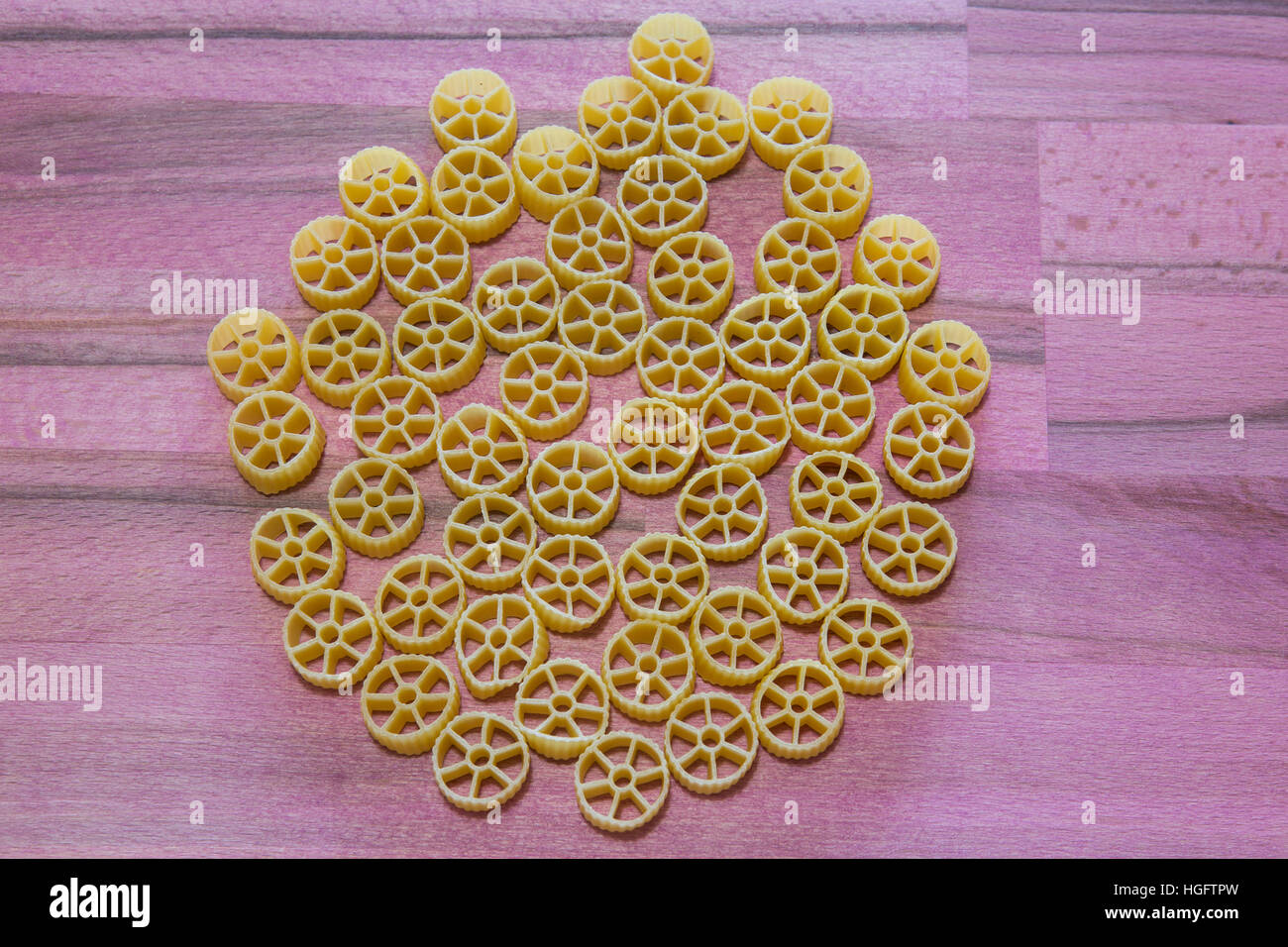 italian pasta ruote  isolated on table wood Stock Photo