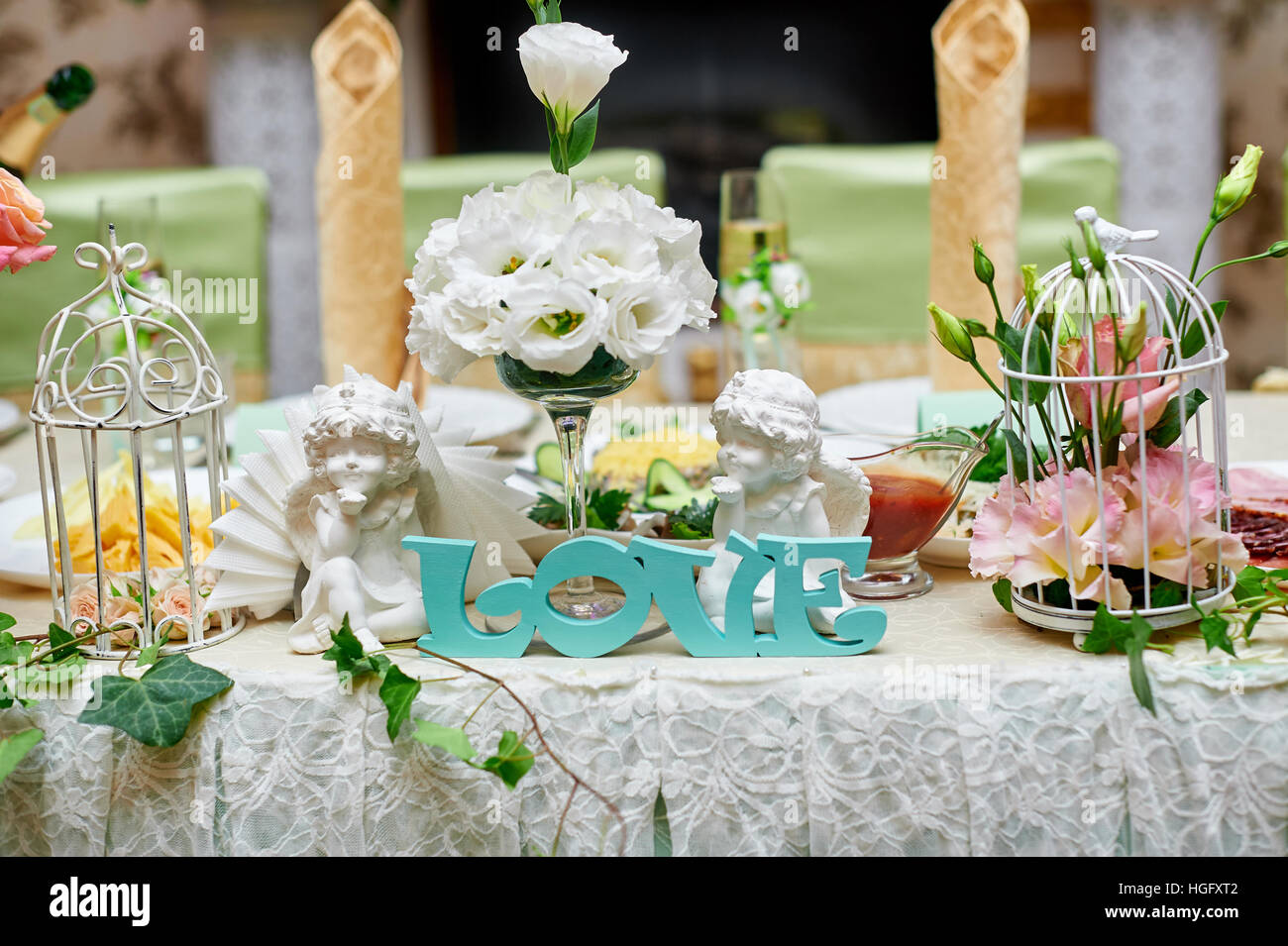 beautiful wedding decorations of flowers on a table in the restaurant Stock Photo