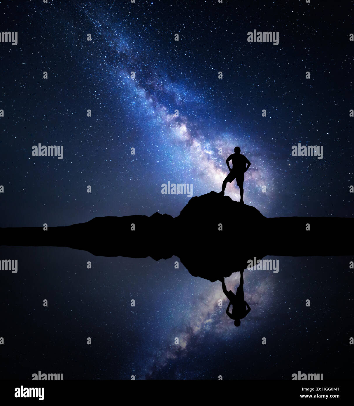 Milky Way. Night starry sky and silhouette of a standing man with ...