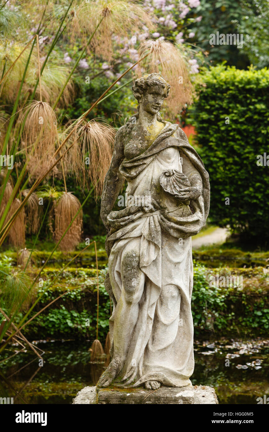 France, Alpes-Maritimes, Menton, garden Serre de la Madone : garden pond with stony statue Stock Photo