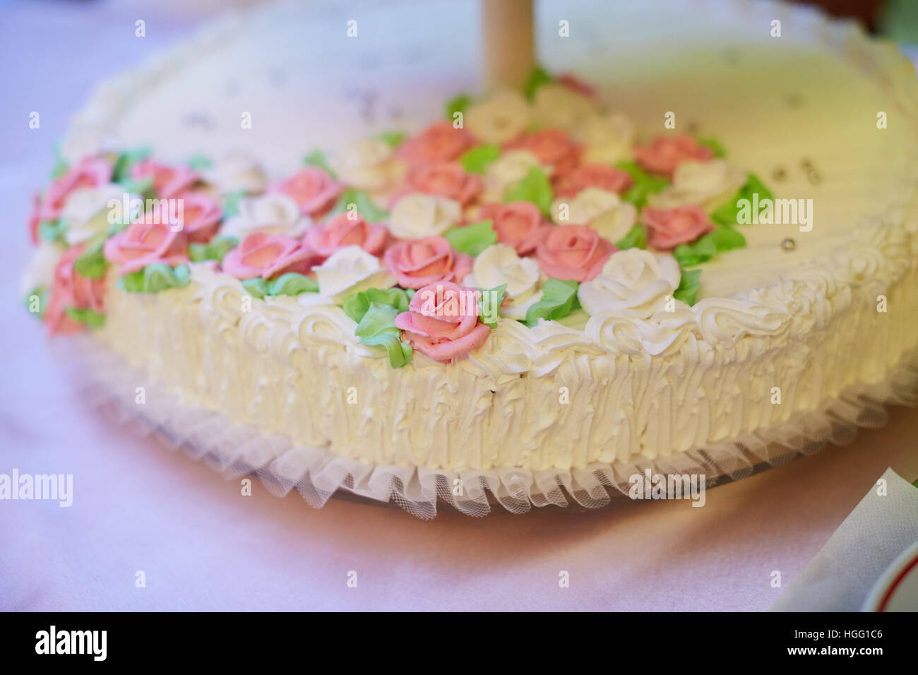 White Vintage Wedding Cake on evening reception Stock Photo
