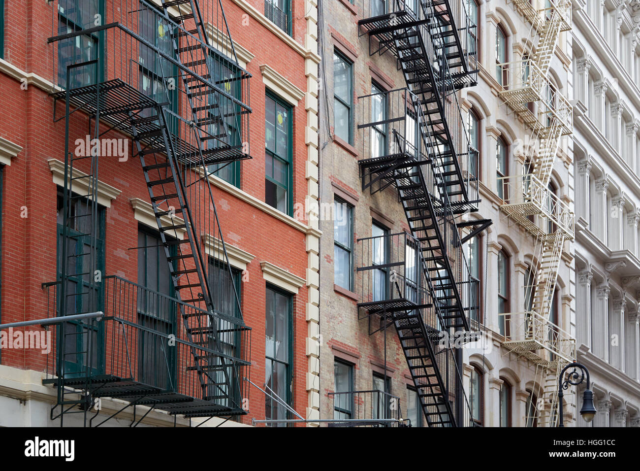 Building facades with fire escape stairs in Soho, New York Stock Photo