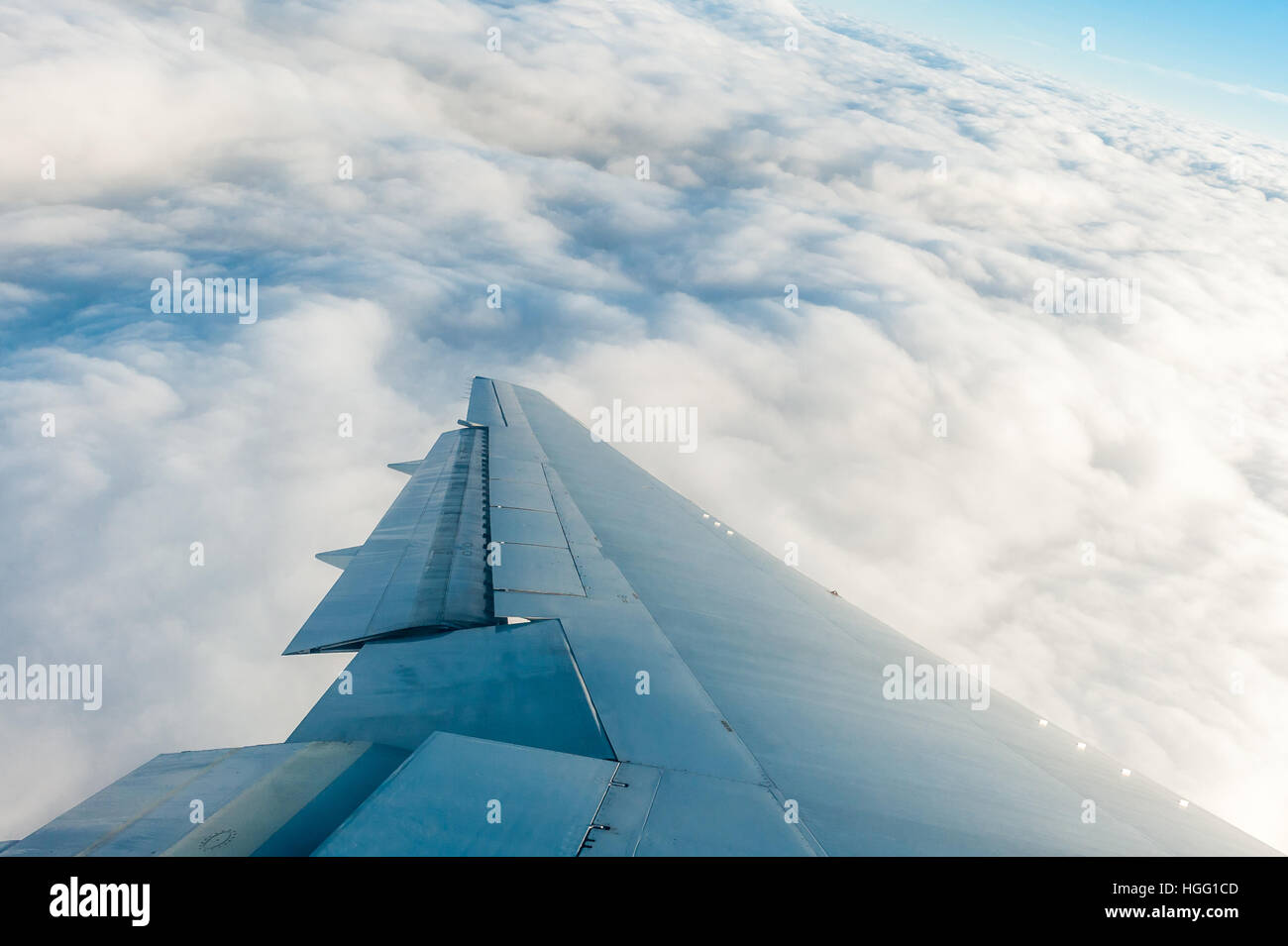 Plane flying over clouds Stock Photo Alamy