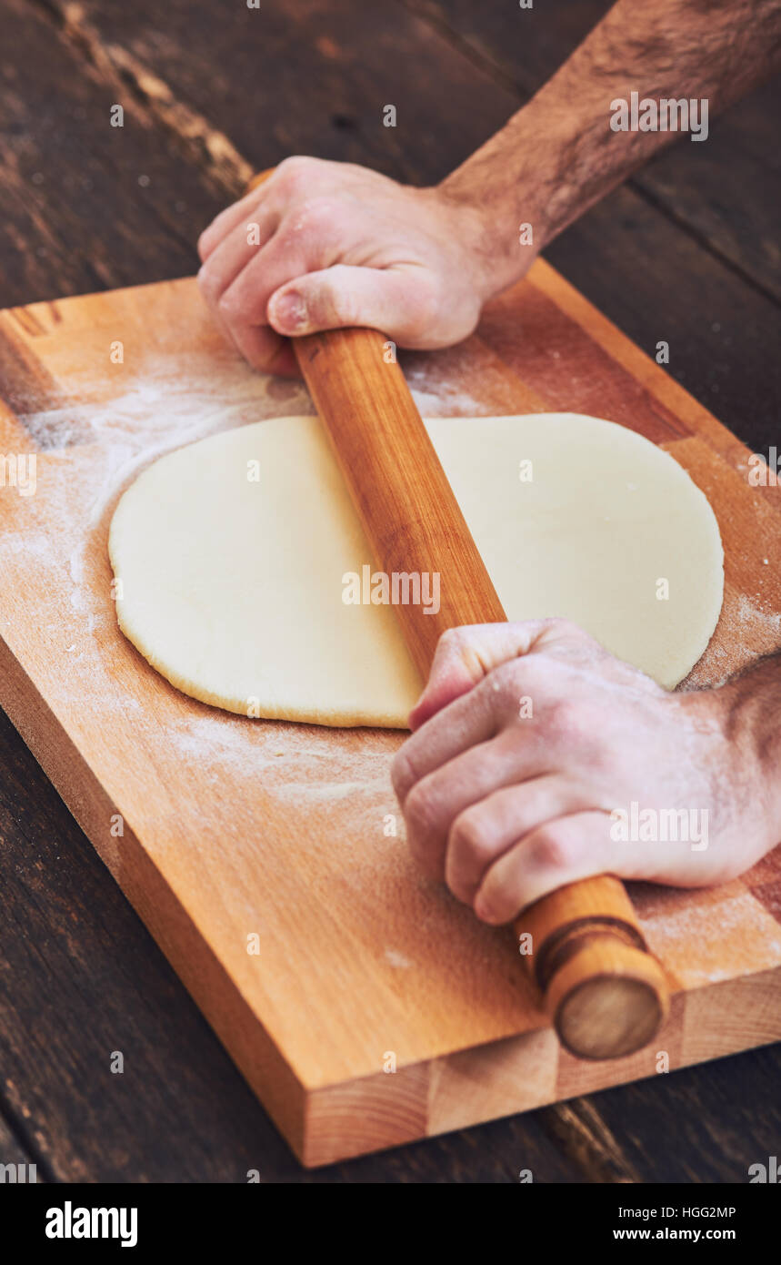 Making handmade pasta with wooden rolling pin Stock Photo Alamy
