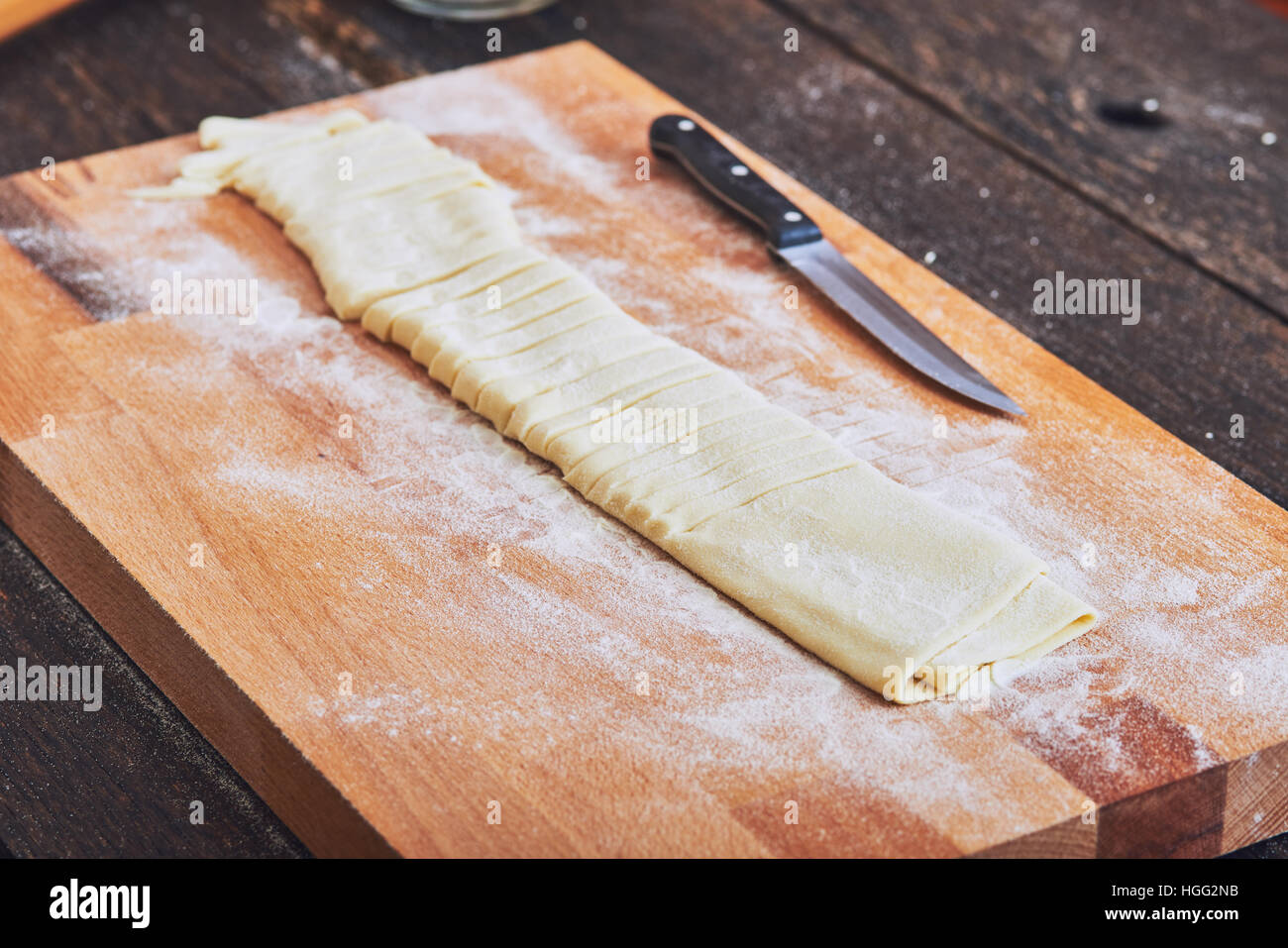Making handmade pasta on wooden table Stock Photo