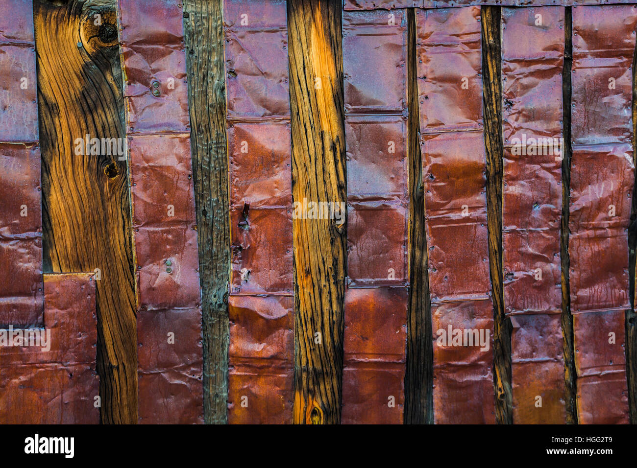Rusted metal siding on a building from long ago in the old silver ...