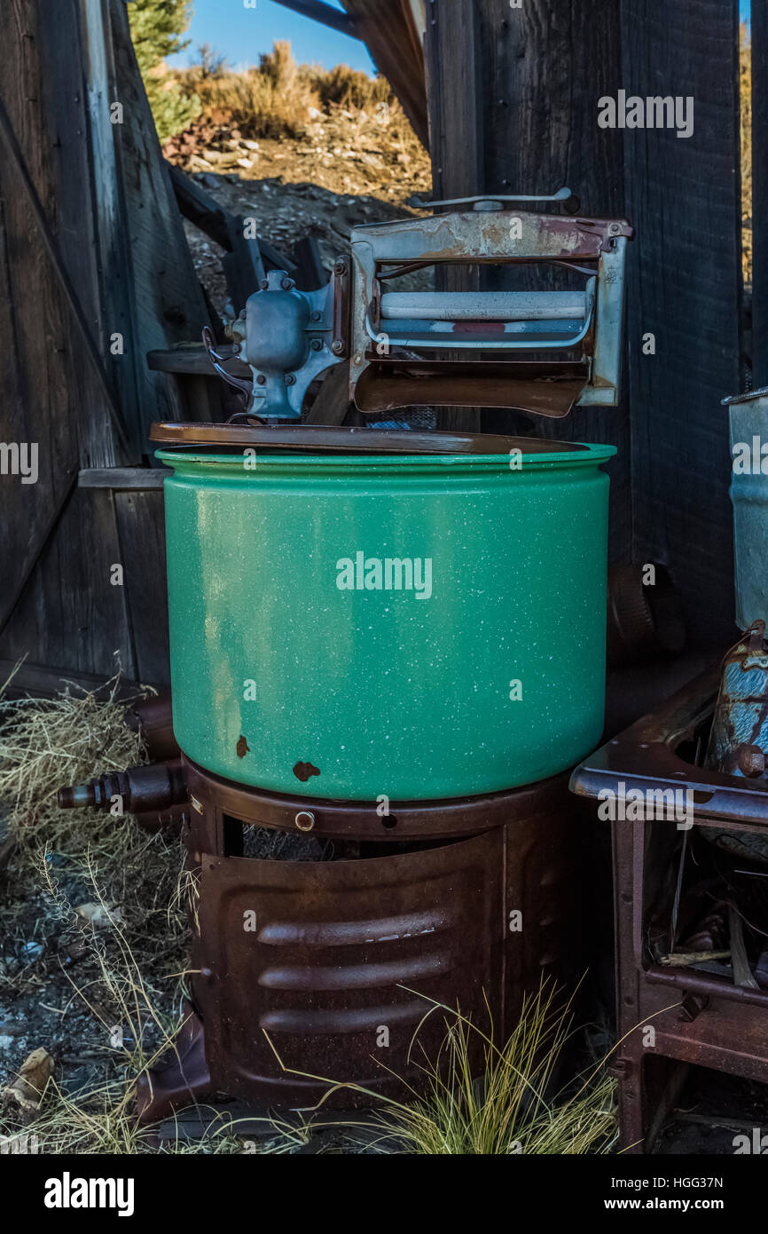 Antique green wringer washing machine in the old silver mining semi ghost town of Belmont, Nevada, USA [No property release; available for editorial l Stock Photo