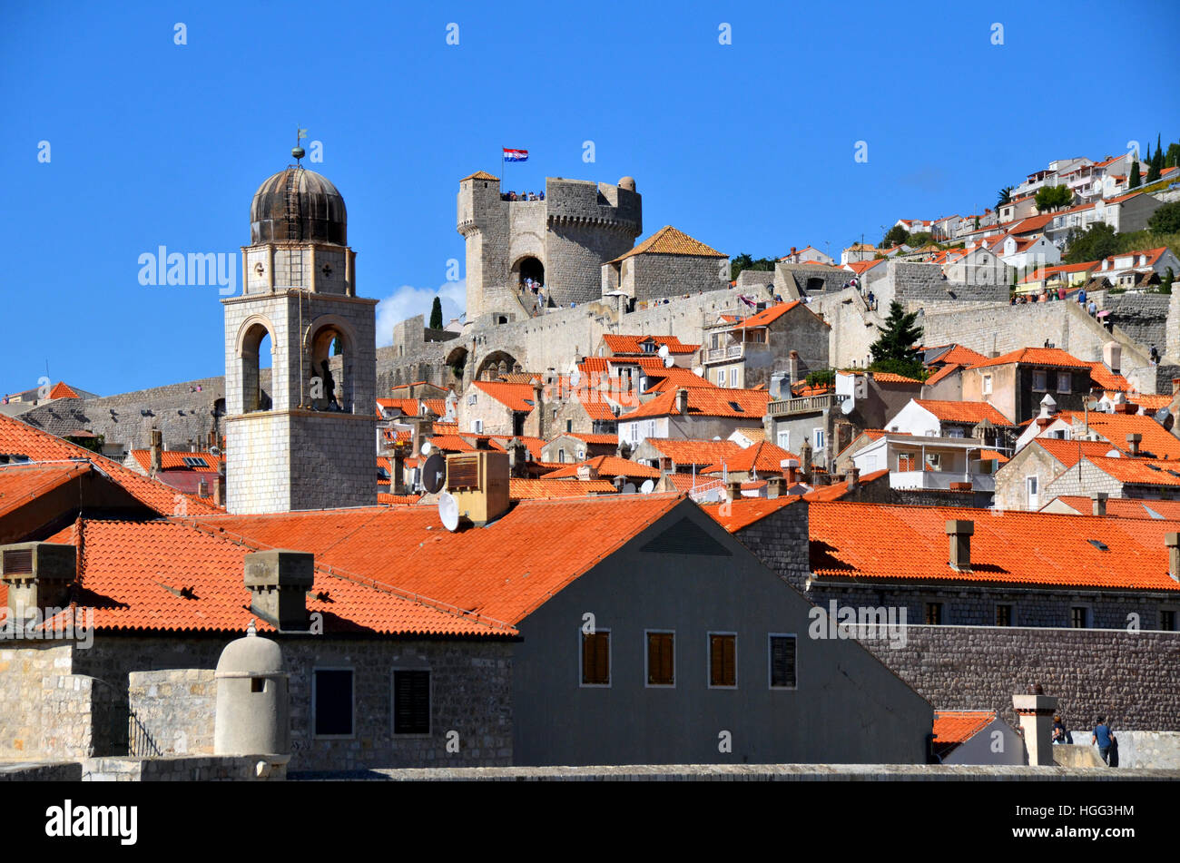 Red tiled roof tops of the city of Dubrovnik, Croatia, including the city bell tower and Minceta tower. Stock Photo