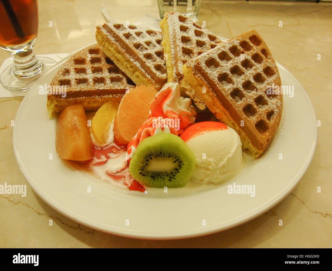 Belgian waffles with fruits and ice cream Stock Photo - Alamy
