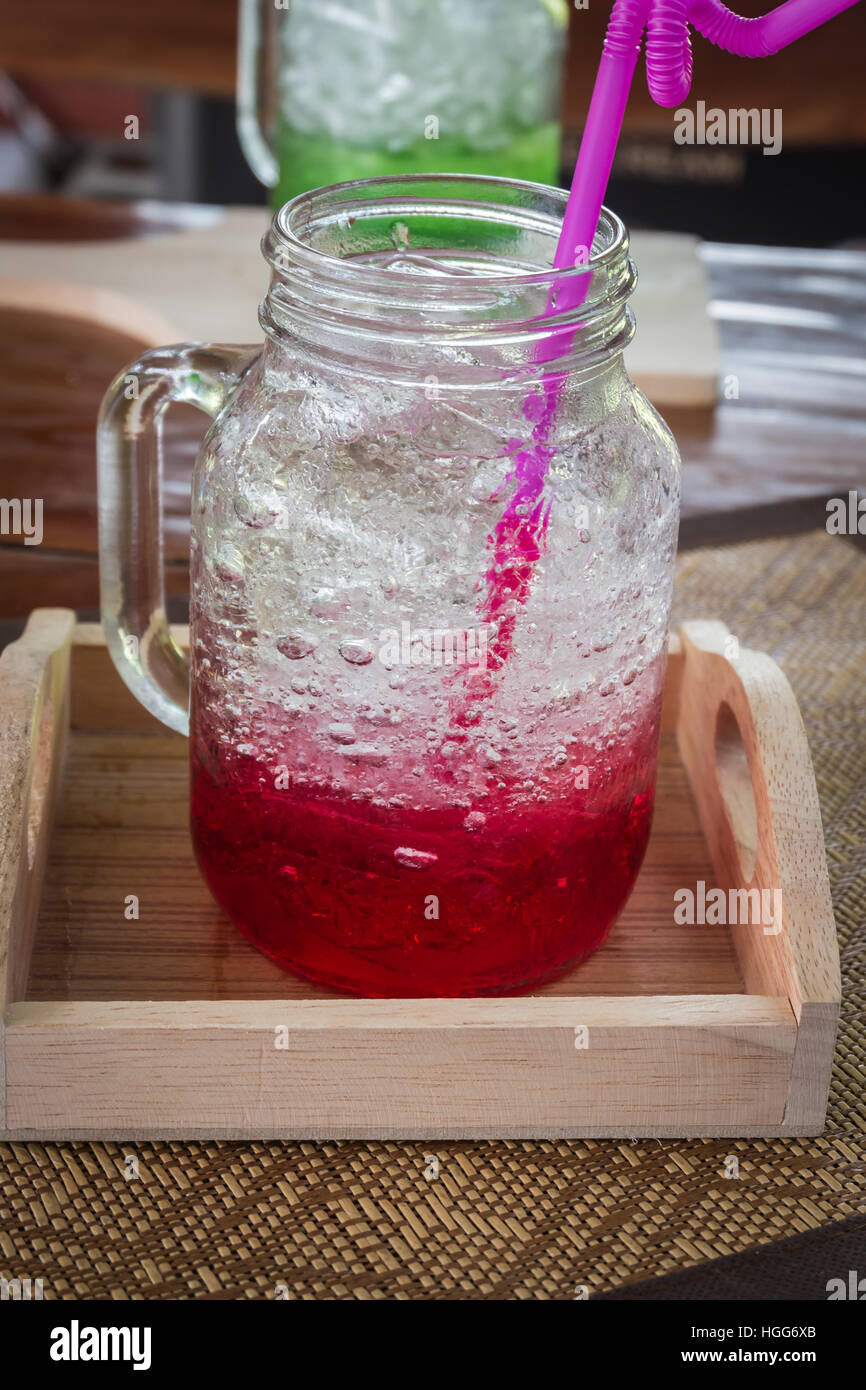Red water mix soda on table background,process color Stock Photo Alamy