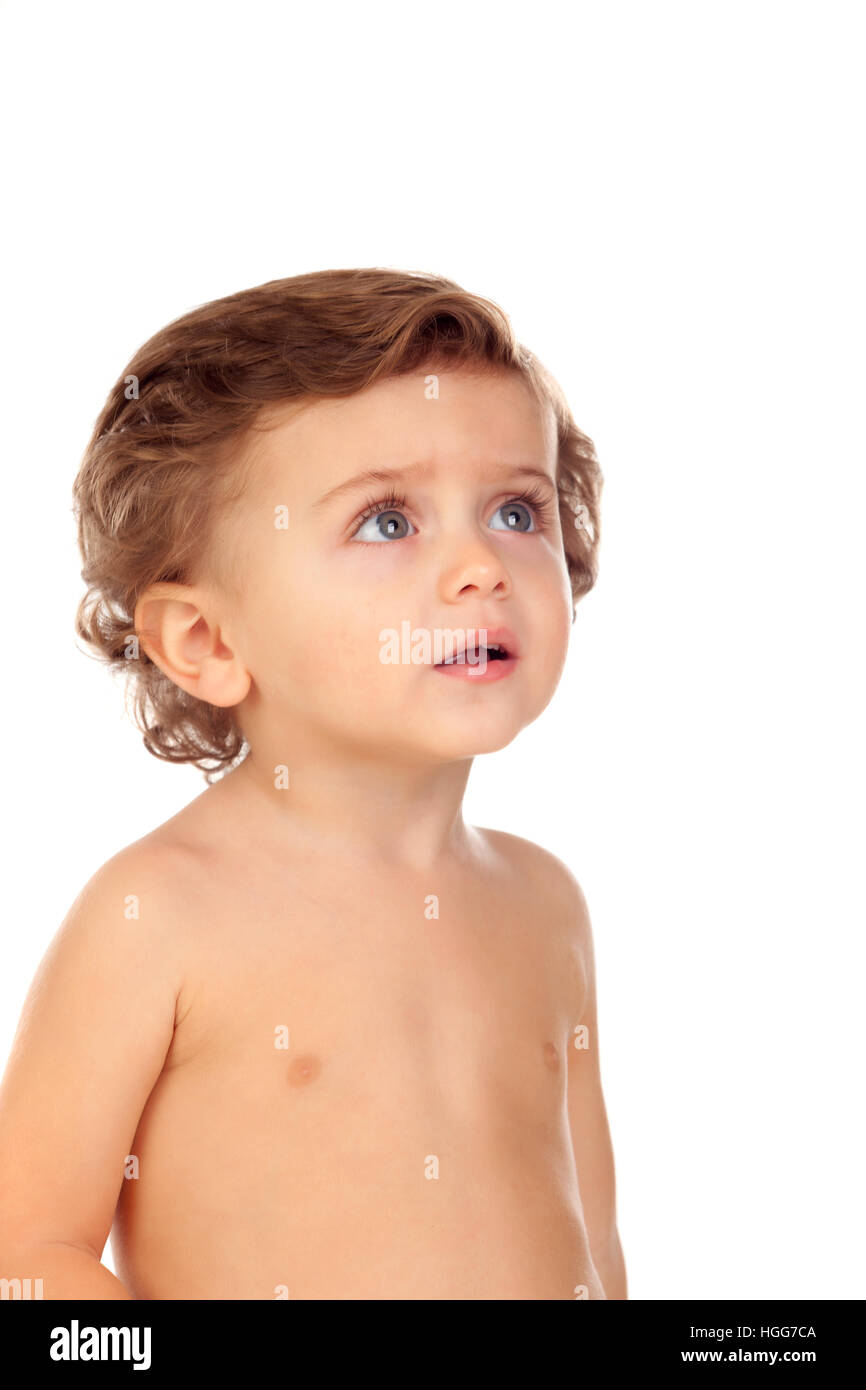 Adorable baby with blue eyes looking up isolated on a white background