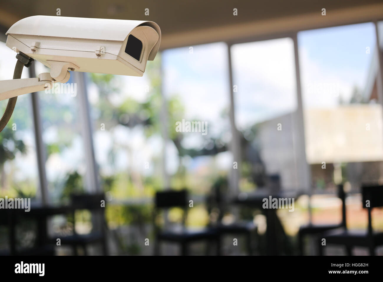 CCTV Camera Record on blur background of people in the cafe,concept of security and safety. Stock Photo