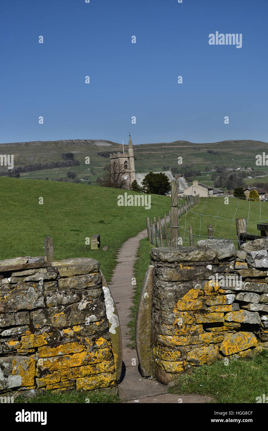Paved footpath, Squeeze stile, St Margaret's Church, Hawes, Wensleydale, Yorkshire Dales, North Yorkshire, England, UK Stock Photo