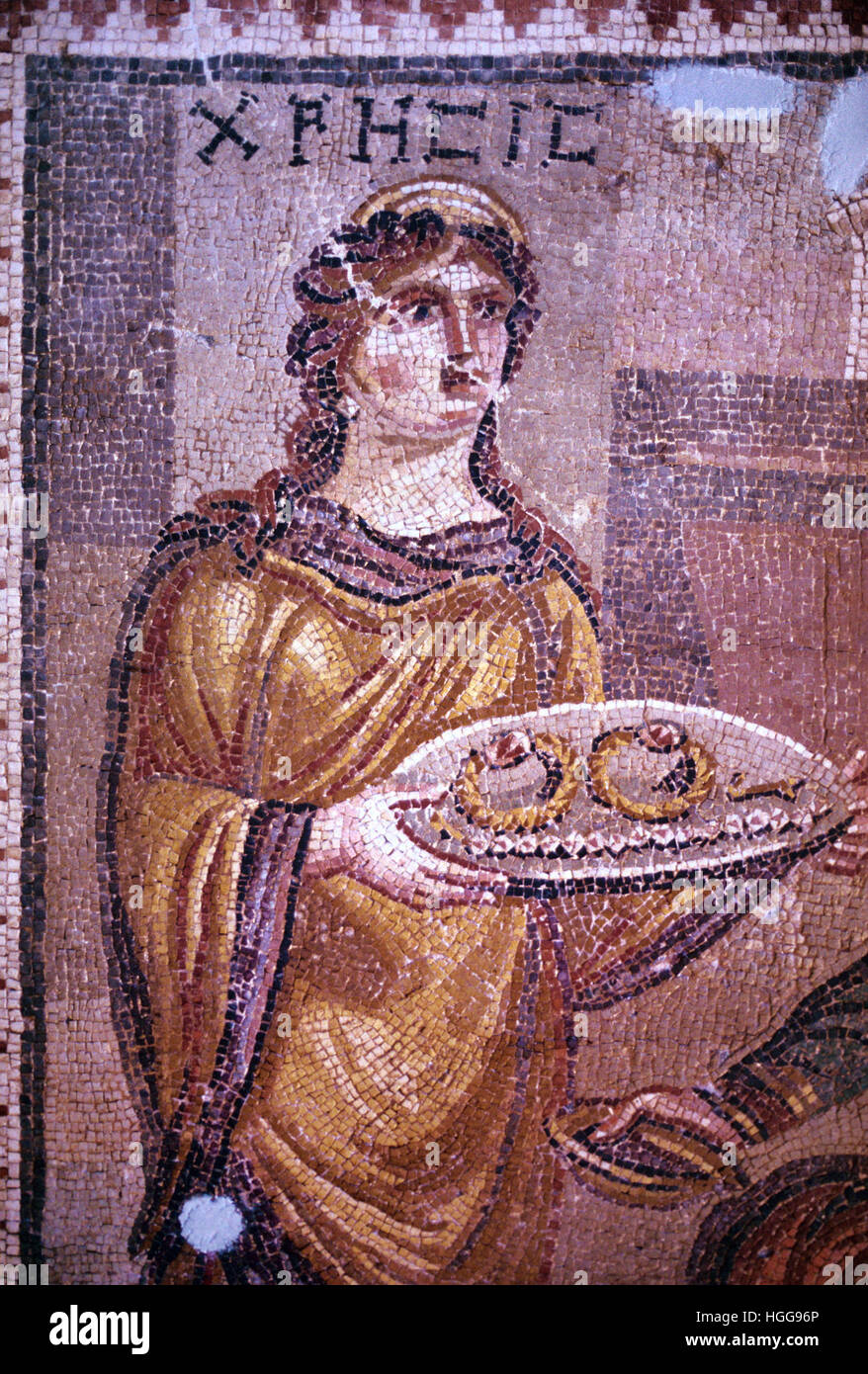 A Prisoner of Agamemnon, Chresis, Wearing a Toga Offers Her Ransom on a Tray in a c4th Roman Mosaic discovered at Harbiye, formerly Daphne, in Turkey. The Mosaic is Displayed in the Hatay Archaeological Museum, Antakya, Turkey Stock Photo