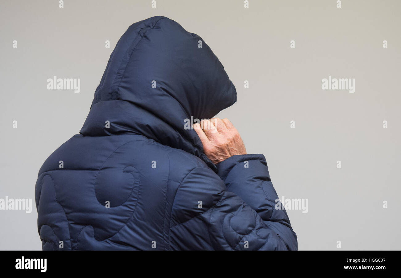 Bochum, Germany. 9th Jan, 2017. The former secret agent Werner Mauss hides his face under a hood at the the district court in Bochum, Germany, 9 January 2017. The tax trial against the legendary ex-agent Mauss concerns an alleged secret fonds which financed his missions. Photo: Bernd Thissen/dpa/Alamy Live News Stock Photo