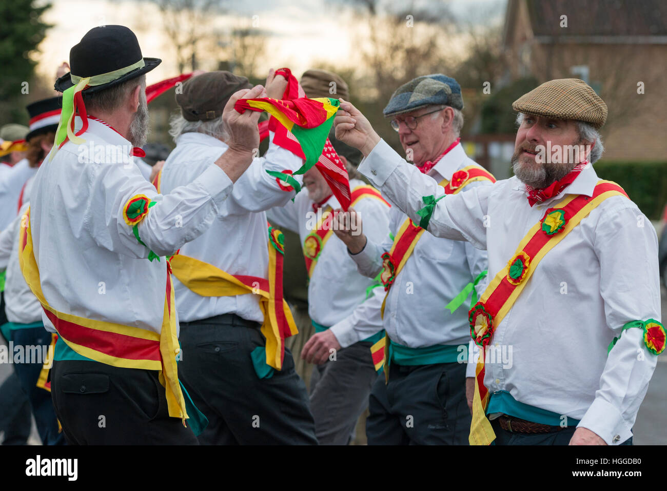 Comberton Cambridge UK 9th January 2017. The Cambridge Morris Men perform a Molly dance in the street to celebrate Plough Monday, the traditional start of the new agricultural year on the first Monday after Epiphany, the Twelfth Day of Christmas. This is a tradition popular in East Anglia. Today the group performed at schools and will join up other dancers to continue celebrations in local pubs. Credit Julian Eales/Alamy Live News Stock Photo