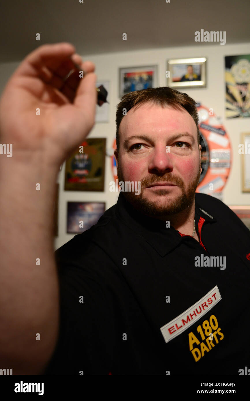 Darts player Brian 'Doggy' Dawson at his home in Thurnscoe near Barnsley, South Yorkshire, UK. Stock Photo