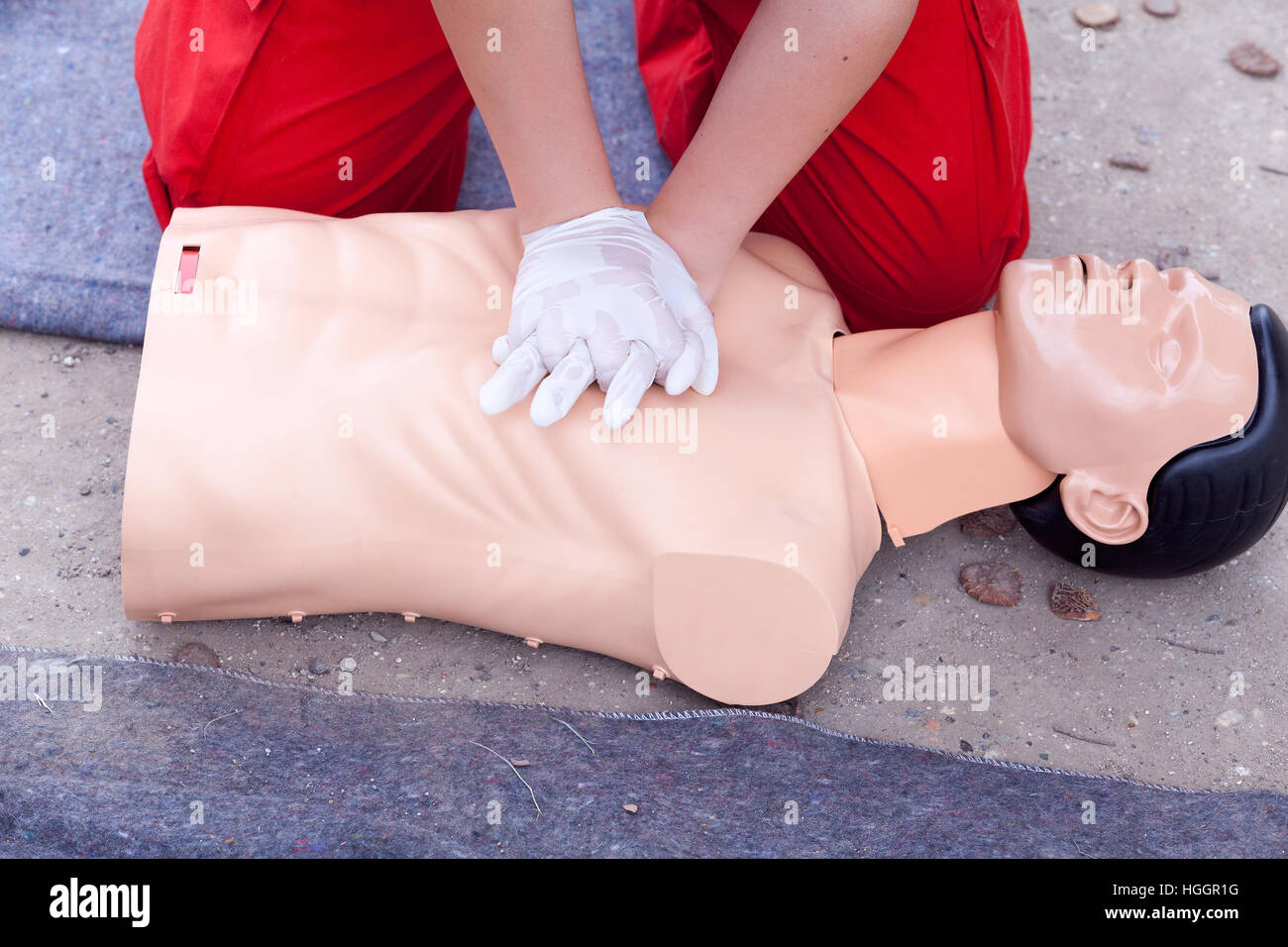 Rescuer practicing heart massage Stock Photo