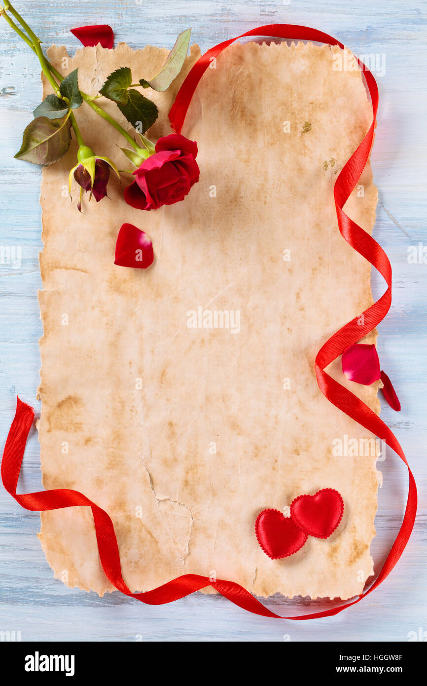 Ancient paper, roses ribbon and hearts Stock Photo - Alamy