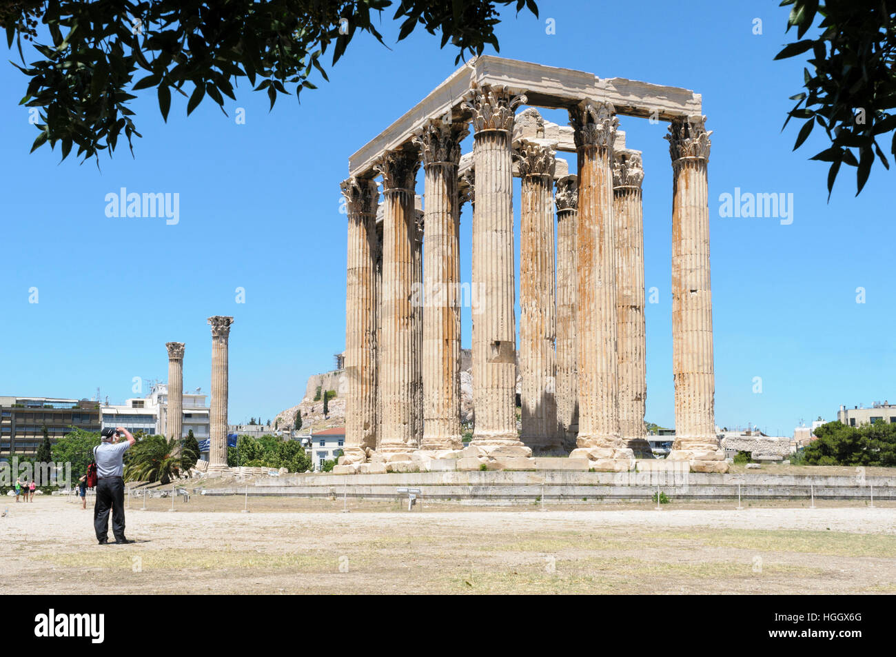 Tourist photographing the Temple of Olympian Zeus, Athens, Greece Stock Photo