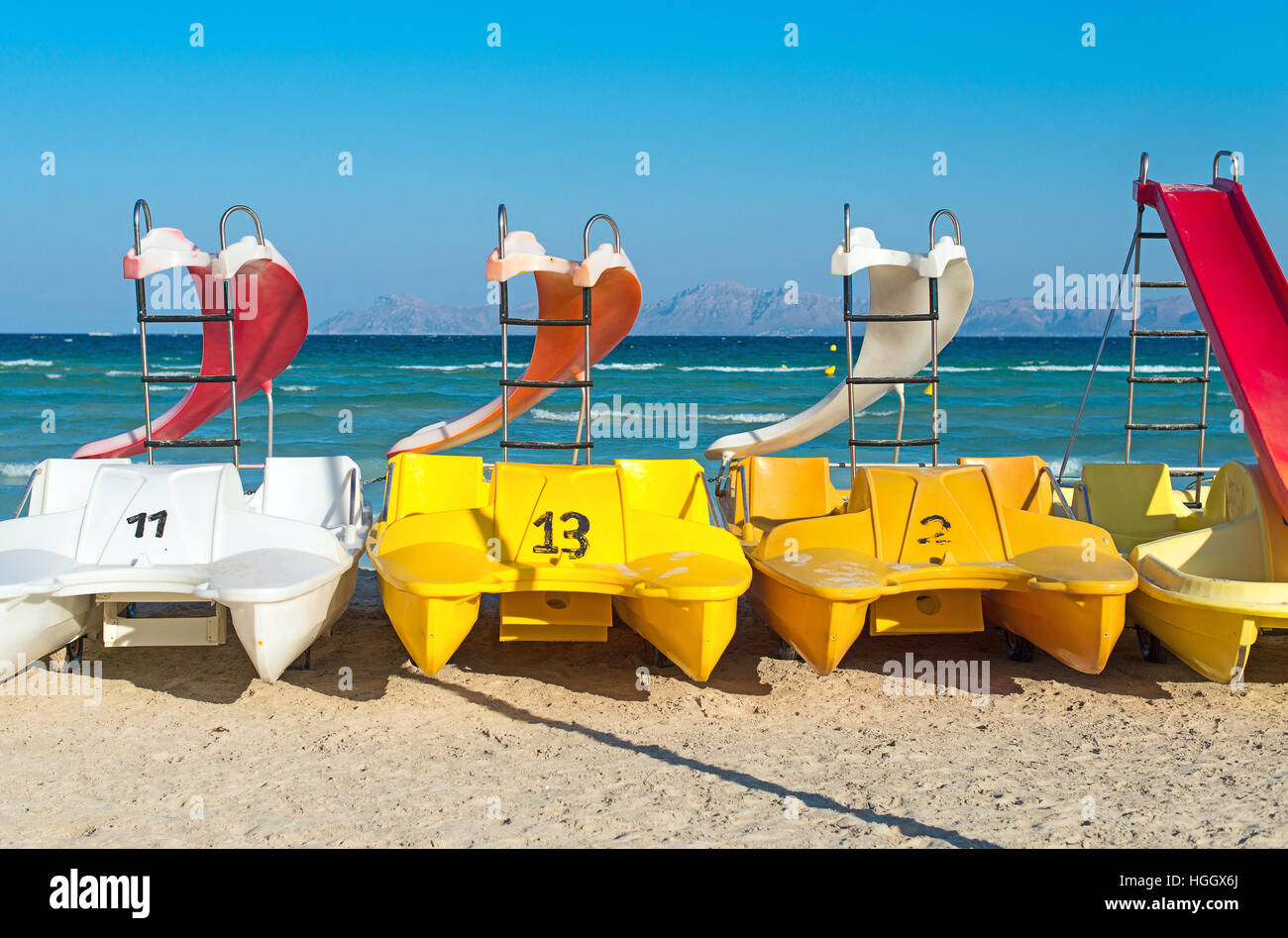 Pedalboats with water slides on the beach Stock Photo Alamy