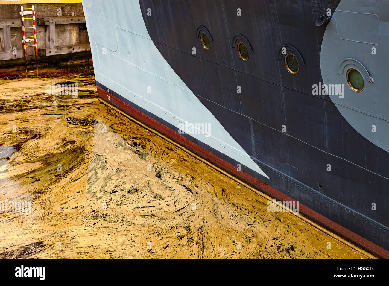 Oil spill from the ship Texture of crude oil spill on the water Stock