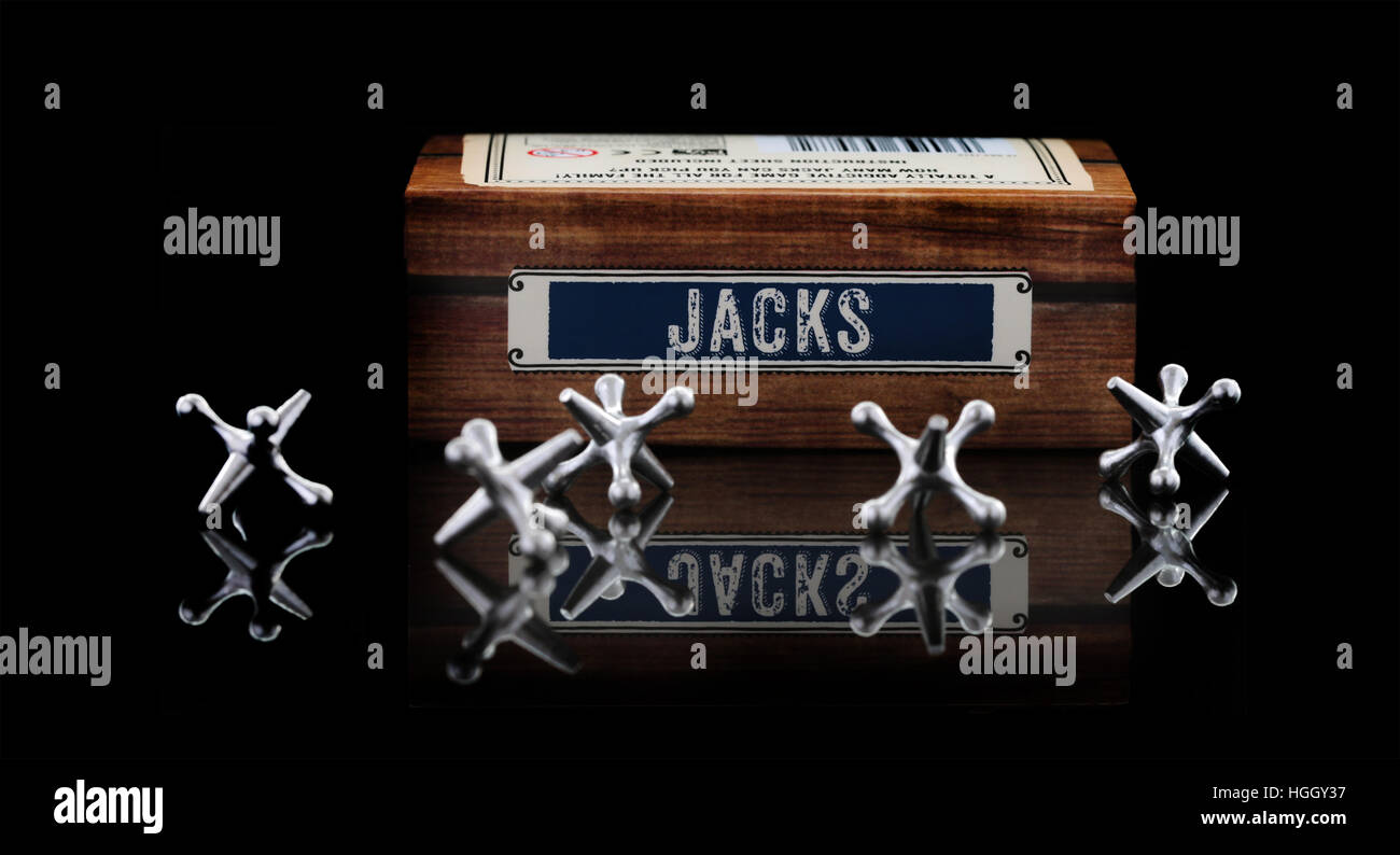 Game of Jacks on a black background Stock Photo