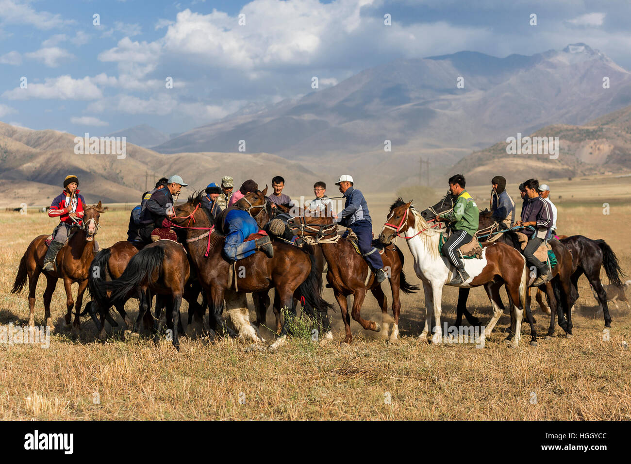 Kazakh men playing nomadic horse game known as Kokpar or Buzkashi in Aksu, Zhabagly, Kazakhstan Stock Photo