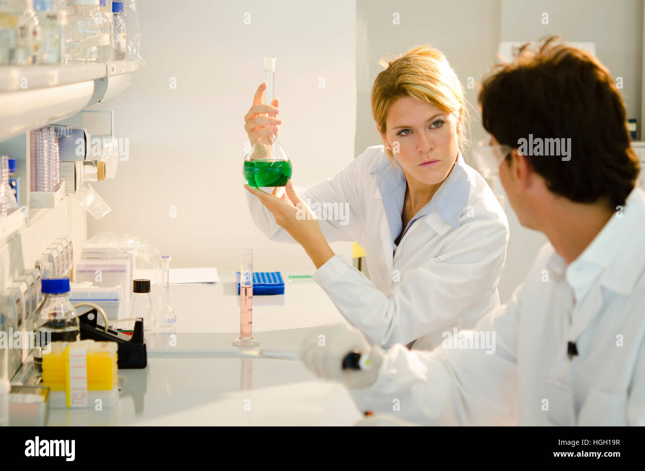 Two young researchers at work Stock Photo - Alamy