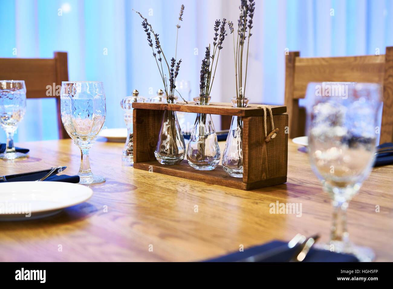 Serving dinner table with herbarium design in a restaurant Stock Photo